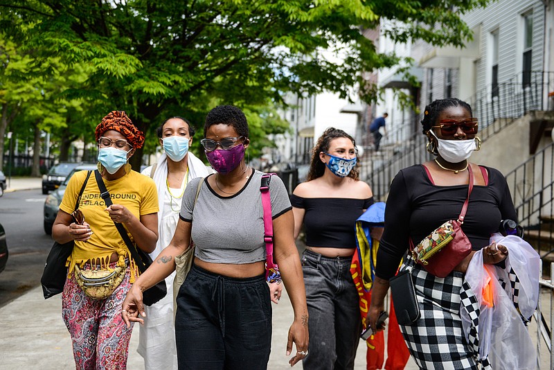 Photo by Marian Carrasquero of The New York Times / People wearing face masks in Brooklyn on Monday, May 25, 2020.