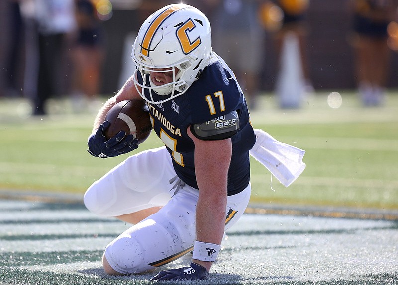 Staff photo / UTC tight end Chris James scores during a home game against James Madison University on Sept. 21, 2019. HeroSports.com selected him as a preseason third-team All-American on Thursday.