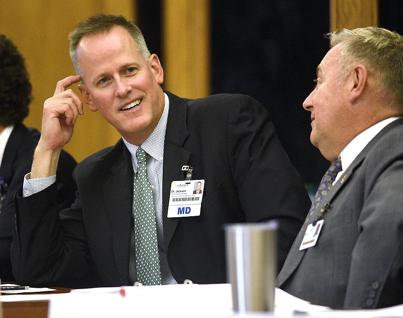 Staff Photo by Robin Rudd/ Erlanger President and CEO William Jackson, left at a hospital board meeting on September 26, 2019.