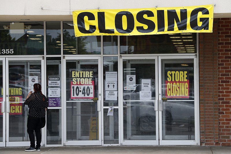 A woman walks into a closing Gordmans store, Thursday, May 28, 2020, in St. Charles, Mo. Stage Stores, which owns Gordmans, is closing all its stores and has filed for Chapter 11 bankruptcy. (AP Photo/Jeff Roberson)


