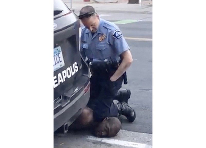 FILE - In this Monday, May 25, 2020, file frame from video provided by Darnella Frazier, a Minneapolis officer kneels on the neck of George Floyd, a handcuffed man who was pleading that he could not breathe, in Minneapolis. Police around the U.S. and law enforcement experts are broadly condemning the way Floyd, who died in police custody, was restrained by a Minneapolis officer who dug his knee into the man's neck. (Darnella Frazier via AP, File)


