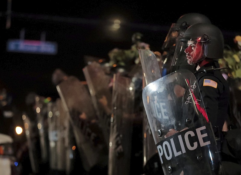 A Memphis Police officer looks out into the crowd during a protest over the death of George Floyd, Thursday, May 28, 2020, in Memphis, Tenn. (Patrick Lantrip/Daily Memphian via AP)


