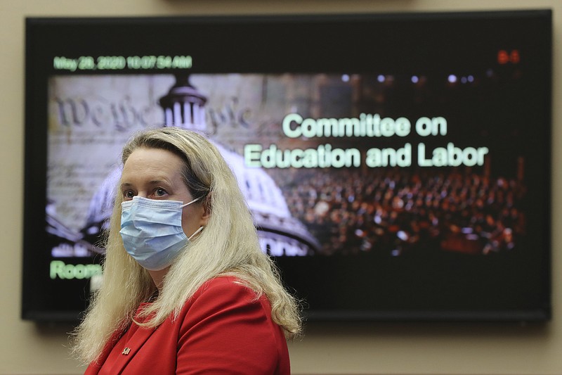 Loren Sweatt, Principal Deputy Assistant Secretary of Labor for Occupational Safety and Health, prepares to testify before a House Committee on Education and Labor Subcommittee on Workforce Protections hearing examining the federal government's actions to protect workers from COVID-19, Thursday, May 28, 2020 on Capitol Hill in Washington. (Chip Somodevilla/Pool via AP)


