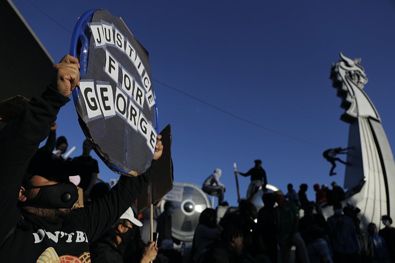 Protesters gather outside the Minnesota Vikings football stadium, Friday, May 29, 2020, in Minneapolis. Protests continued following the death of George Floyd, who died after being restrained by Minneapolis police officers on Memorial Day. (AP Photo/Julio Cortez)

