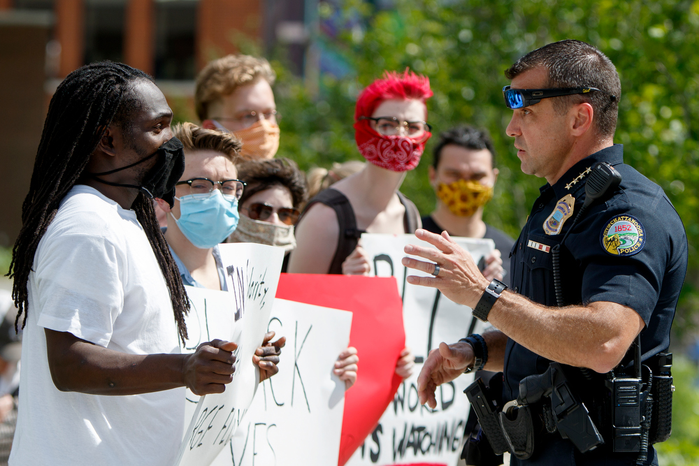 Staff photo by C.B. Schmelter / Chattanooga Police Department Chief David Roddy, right, talks to a protestor at Miller Park on Saturday, May 30, 2020 in Chattanooga, Tenn. People gathered to protest the killing of George Floyd. Floyd, 46, died after being handcuffed and pinned for several minutes beneath Minneapolis police Officer Derek Chauvin's knee.