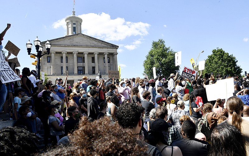 People gather on Legislative Plaza during a rally to protest the death of George Floyd, Saturday, May 30, 2020 in Nashville, Tenn. Protests across the country have escalated over the death of George Floyd who died after being restrained by Minneapolis police officers on Memorial Day, May 25. (Larry McCormack/The Tennessean via AP)

