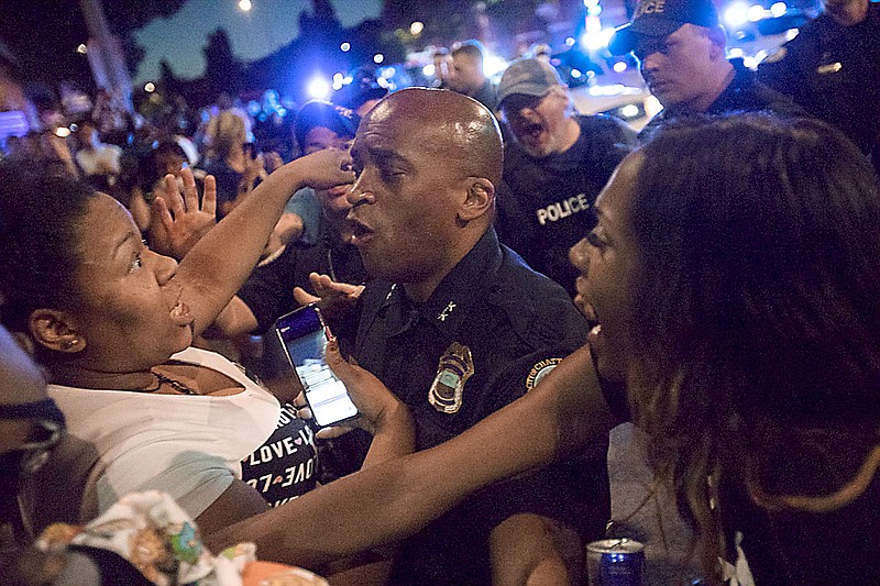 Staff photo by Troy Stolt / Police and protesters clash at the intersection of Frazier and Tremont streets during a protest over the death of George Floyd on Saturday, May 30, 2020 in Chattanooga, Tenn.
