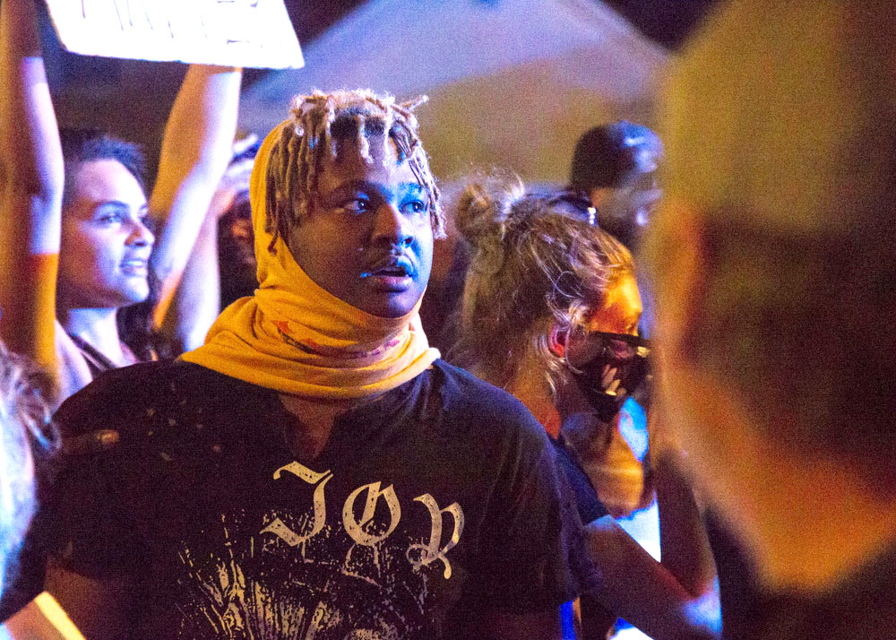 Staff photo by Troy Stolt / A protester engages with Chattanooga Police, Saturday night, on Tremont Street during protests over the murder of George Floyd by Minneapolis police officers.