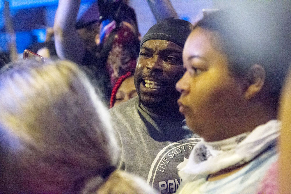 Staff photo by Troy Stolt / A protester engages with Chattanooga Police, Saturday night, on Tremont Street during protests over the murder of George Floyd by Minneapolis police officers.