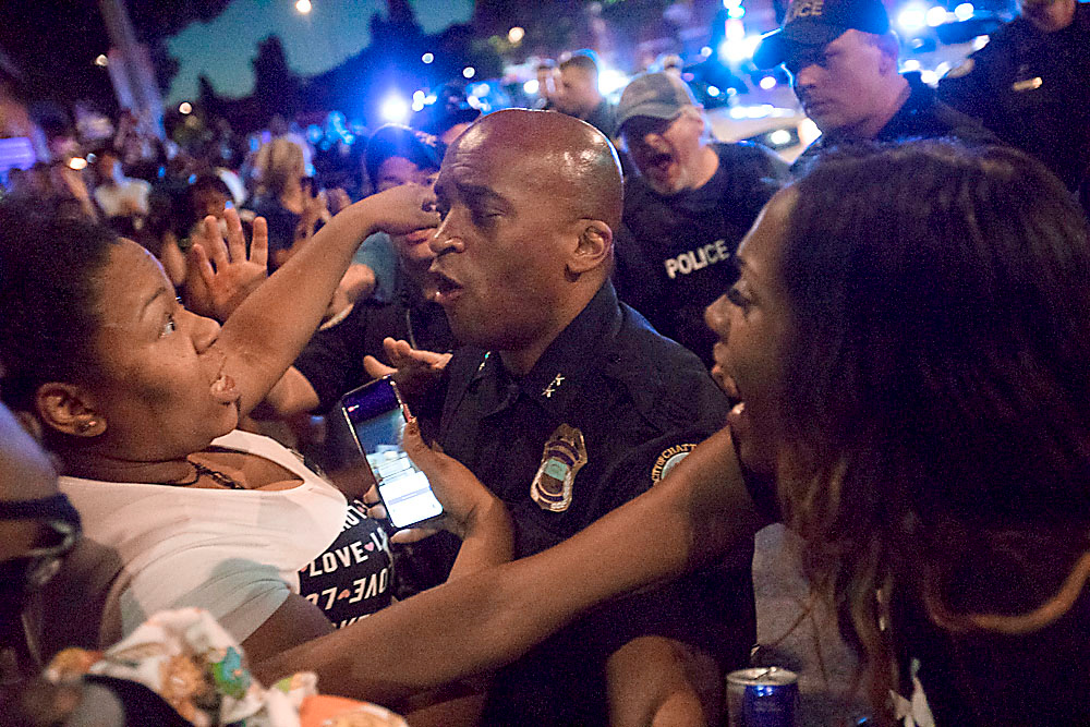 Staff photo by Troy Stolt / Police and Protesters clash, Saturday night, at the intersection of Frazier and Tremont Streets during a protest over the death of George Floyd.