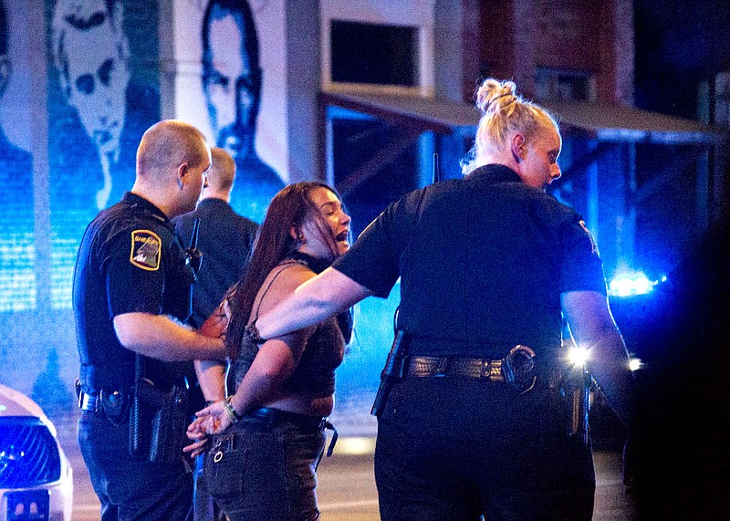 Staff photo by Troy Stolt / Chattanooga Police arrest arrest a woman, Saturday night, protesting the murder of George Floyd by Minneapolis police officers.