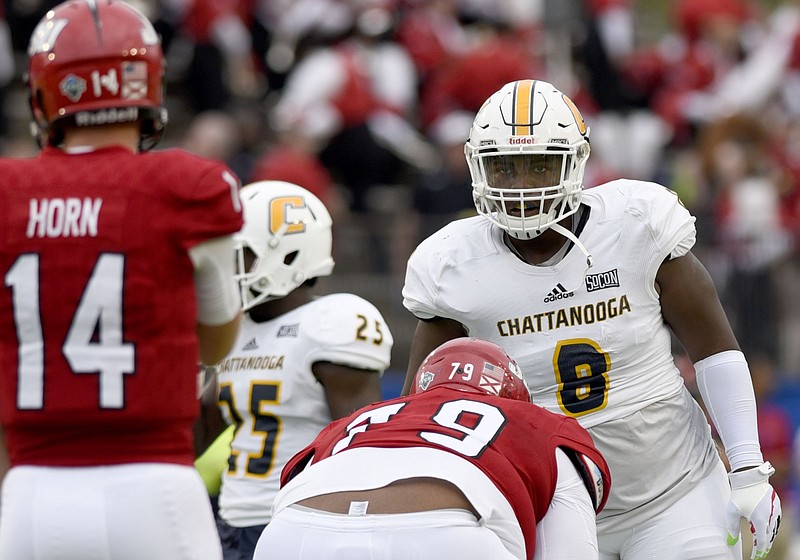 Staff photo by Robin Rudd / UTC defensive lineman Isaiah Mack (8) keeps his eyes on Jacksonville State quarterback Bryant Horn during the Guardian Credit Union FCS Kickoff at the Carmton Bowl on Aug. 26, 2017, in Montgomery, Ala.