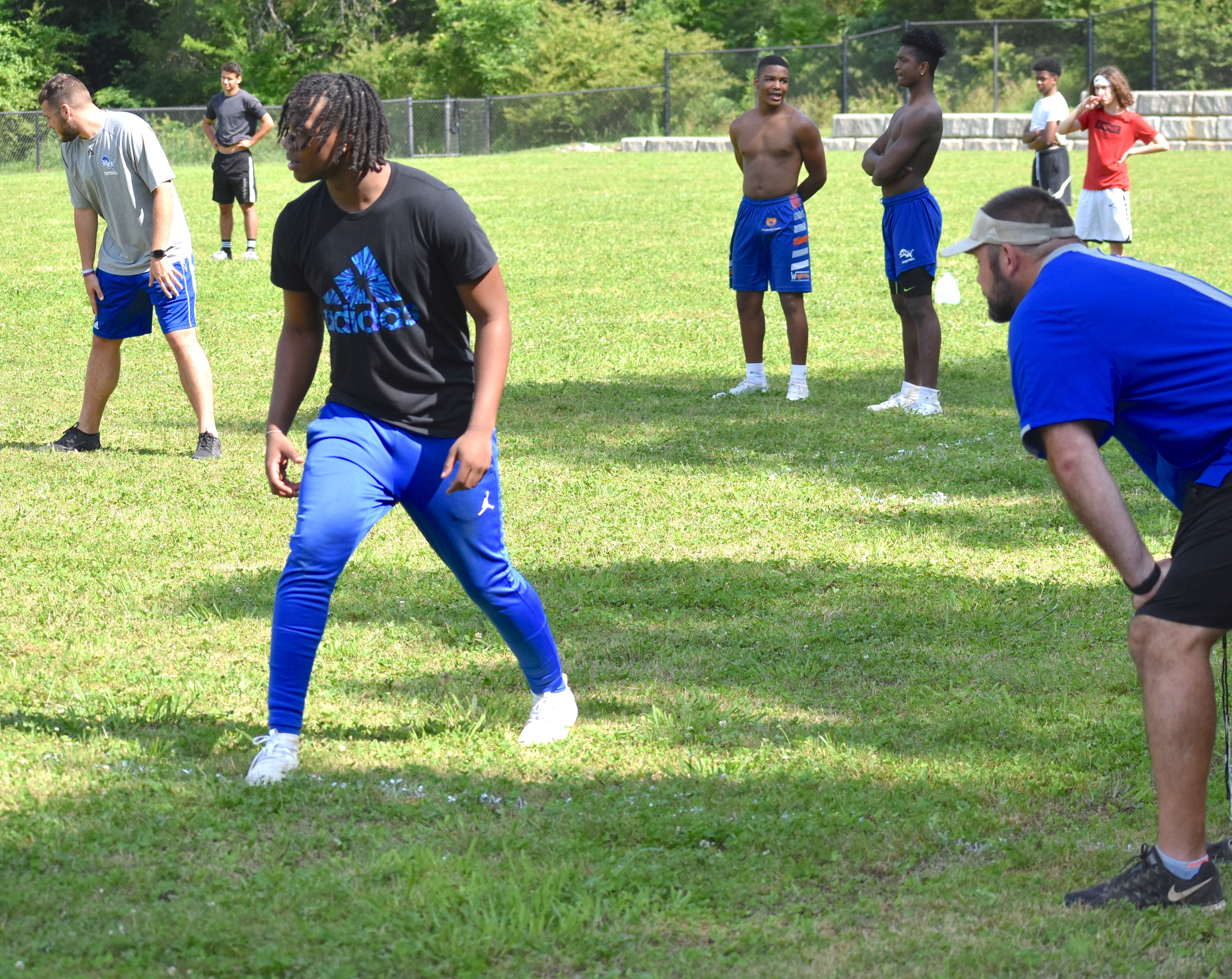 Staff photo by Patrick MacCoon / Red Bank High School football coach Chris Brown looks on as senior Kel Eddins goes through a receiving drill Monday.