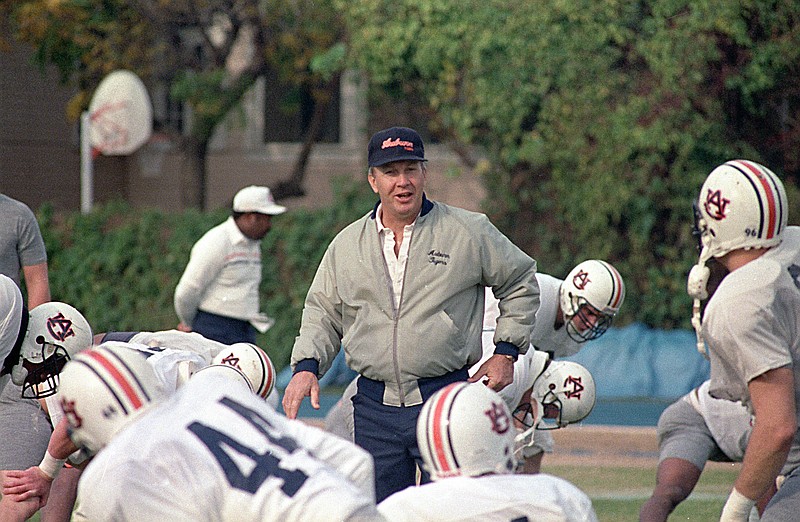 AP photo by Bill Haber / Auburn football coach Pat Dye walks among his players as they practice on Dec. 27, 1988, in preparation for the Sugar Bowl against Florida State in New Orleans.