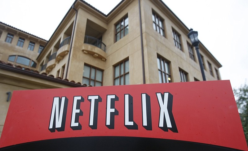 FILE - This Jan. 29, 2010, file photo shows the company logo and view of Netflix headquarters in Los Gatos, Calif. Netflix's normally lighthearted Twitter account took on a more somber tone on Saturday, May 30, 2020: "To be silent is to be complicit. Black lives matter. We have a platform, and we have a duty to our Black members, employees, creators and talent to speak up." (AP Photo/Marcio Jose Sanchez, File)