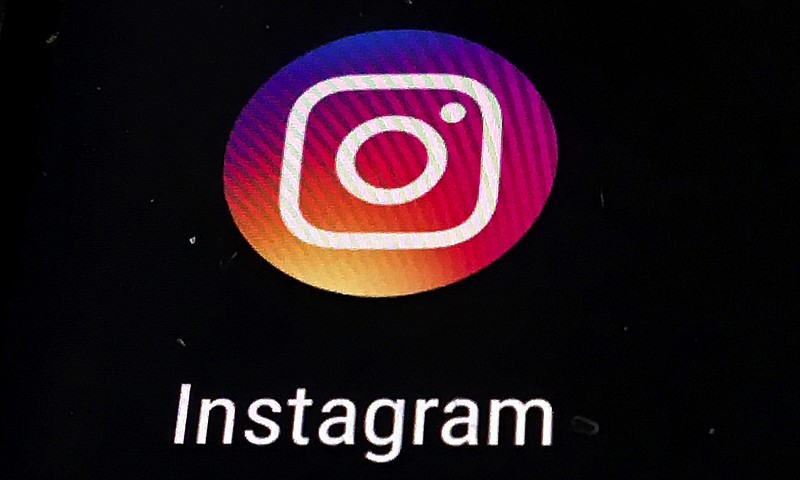 FILE - In this Nov. 29, 2018 file photo, the Instagram app logo is displayed on a mobile screen in Los Angeles. Though Black Out Tuesday was originally organized by the music community, the social media world went dark on Tuesday in support of the Black Lives Matter movement and the many killings of black people around the world that has caused outrage and protests. Instagram accounts, from top record label to everyday people, was full of black squares posted in response to the deaths of George Floyd, Ahmaud Arbery and Breonna Taylor. (AP Photo/Damian Dovarganes, File)


