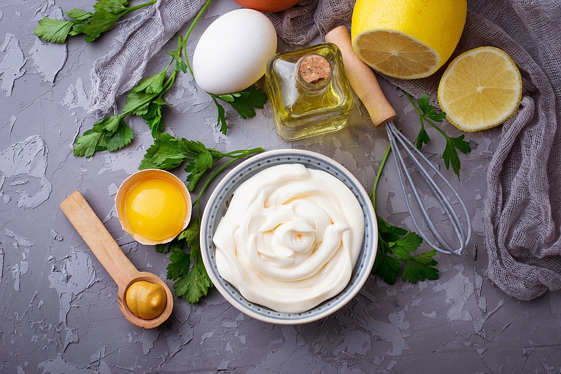 Homemade mayonnaise sauce and olive oil, eggs, mustard, lemon - stock photo food tile mayonnaise tile sauce / Getty Images

