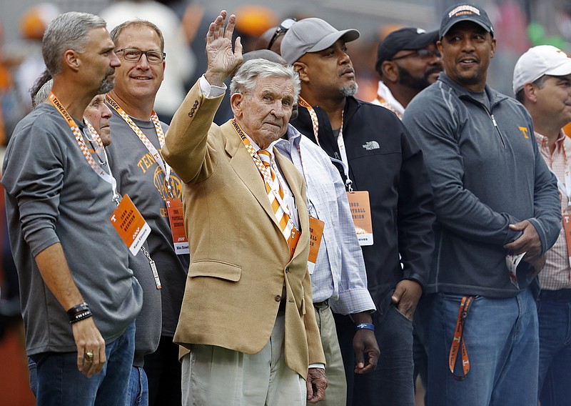 AP photo by Wade Payne / Former University of Tennessee football player and coach Johnny Majors waves to fans while being recognized during the Vols' home game against Mississippi State on Oct. 12, 2019.
