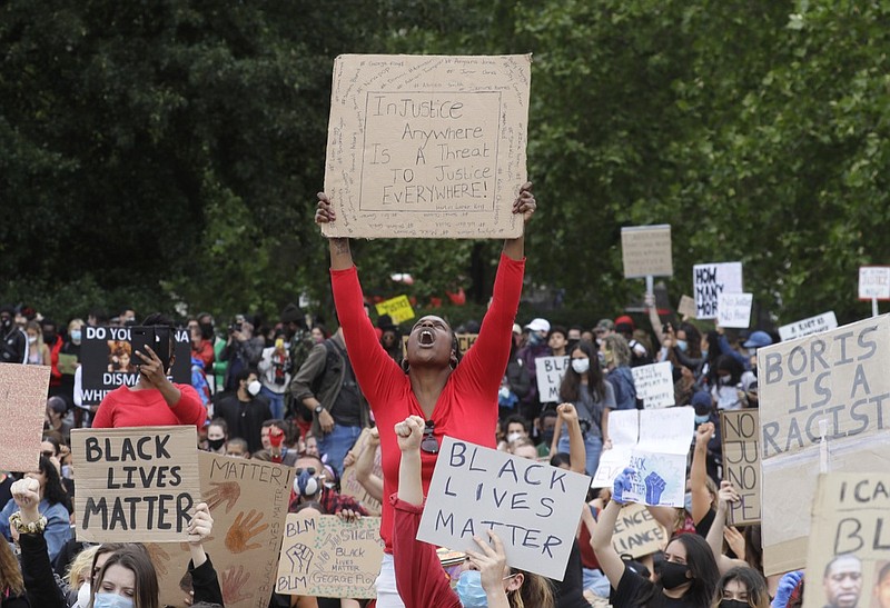 Protesters take part in a demonstration on Wednesday, June 3, 2020, in Hyde Park, London, over the death of George Floyd, a black man who died after being restrained by Minneapolis police officers on May 25. Protests have taken place across America and internationally, after a white Minneapolis police officer pressed his knee against Floyd's neck while the handcuffed black man called out that he couldn't breathe. The officer, Derek Chauvin, has been fired and charged with murder. (AP Photo/Kirsty Wigglesworth)