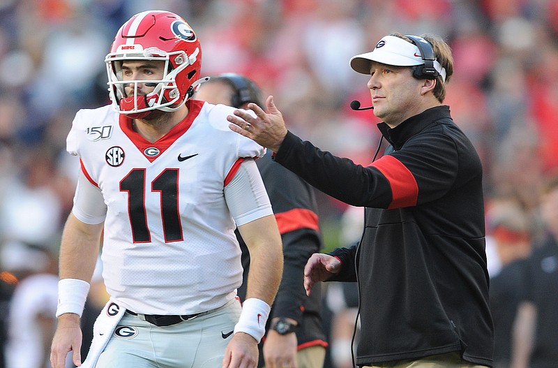 Georgia photo by Philip Williams / Georgia quarterback Jake Fromm and Bulldogs coach Kirby Smart meet during last November's 21-14 win at Auburn.