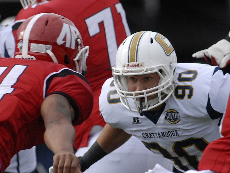 Staff photo by Robin Rudd / UTC defensive lineman Davis Tull (90) goes eye to eye with Austin Peay quarterback Darrien Boone on Sept. 13, 2014, in Clarksville, Tenn.