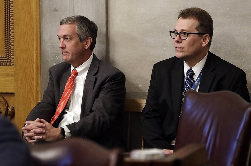 FILE - In this April 15, 2019, file photo, Tennessee Secretary of State Tre Hargett, left, attends a House session, in Nashville, Tenn. Hargett, who had previously argued the original 2019 voter registration law would bolster election security, is submitting a separate bill in 2020 that will criminalize "intentional dissemination of misinformation" surrounding the qualifications to vote, voter registration requirements, voter eligibility and polling dates, times and locations. (AP Photo/Mark Humphrey, File)


