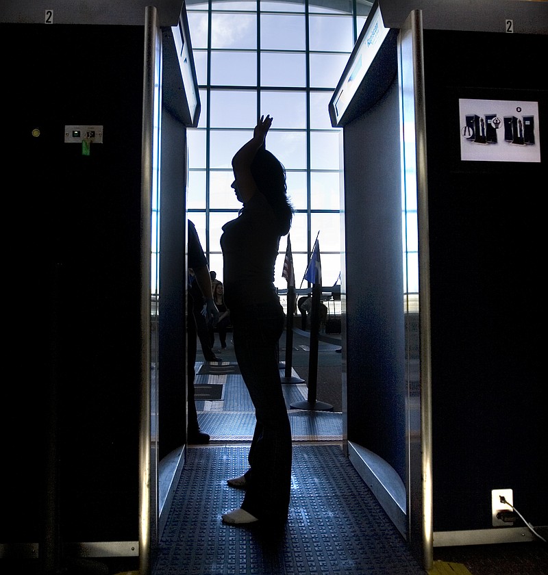 FILE - In this Nov. 24, 2010, file photo. an unidentified passenger participates in a full-body scan at the El Paso International Airport in El Paso, Texas. The metal detectors that greet sports fans at the gates might soon be accompanied by thermal body scanners, in the gargantuan task of better protecting venues from virus spread in order to bring the games back for in-person viewing. (Mark Lambie/The El Paso Times via AP, File)



