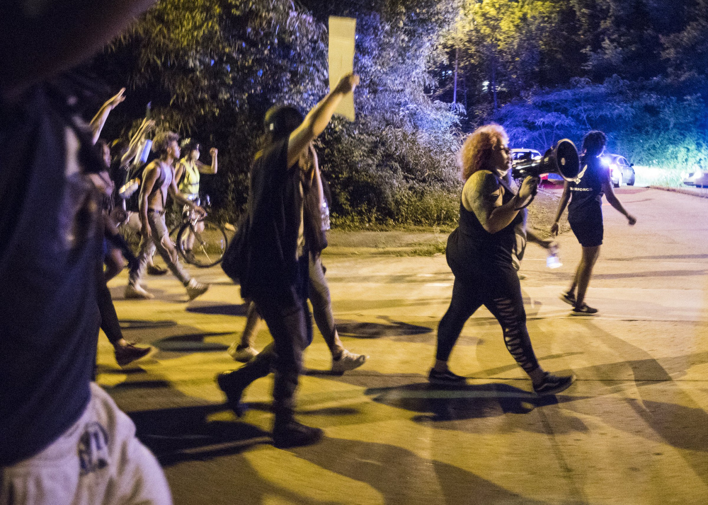 Staff photo by Troy Stolt / Protester Grayson Harvey leads protesters through College Hill Courts during a peaceful demonstration on the sixth day of protests over the death of George Floyd on Thursday, June 4, 2020 in Chattanooga, Tenn.