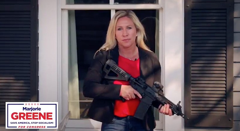 A screenshot from an ad by Marjorie Greene and her campaign that was removed from Facebook for inciting violence.