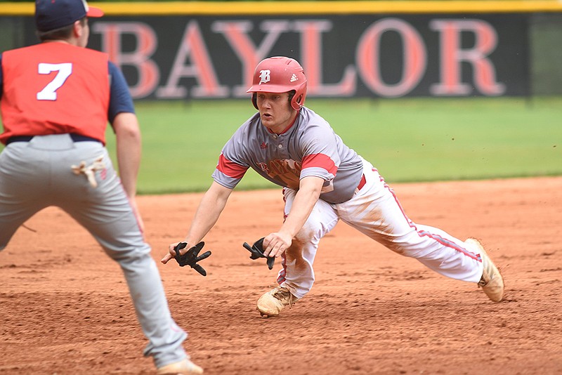 Staff photo / Baylor's Gehrig Ebel dives for the bag as Brentwood Academy third baseman Ben Pearce awaits the throw during a game at Baylor on April 19, 2019. Ebel, whose 2020 senior season with the Red Raiders was wiped out by the coronavirus pandemic canceling the TSSAA's spring sports schedule, is excited to return to the diamond with his eXposure Baseball select team.