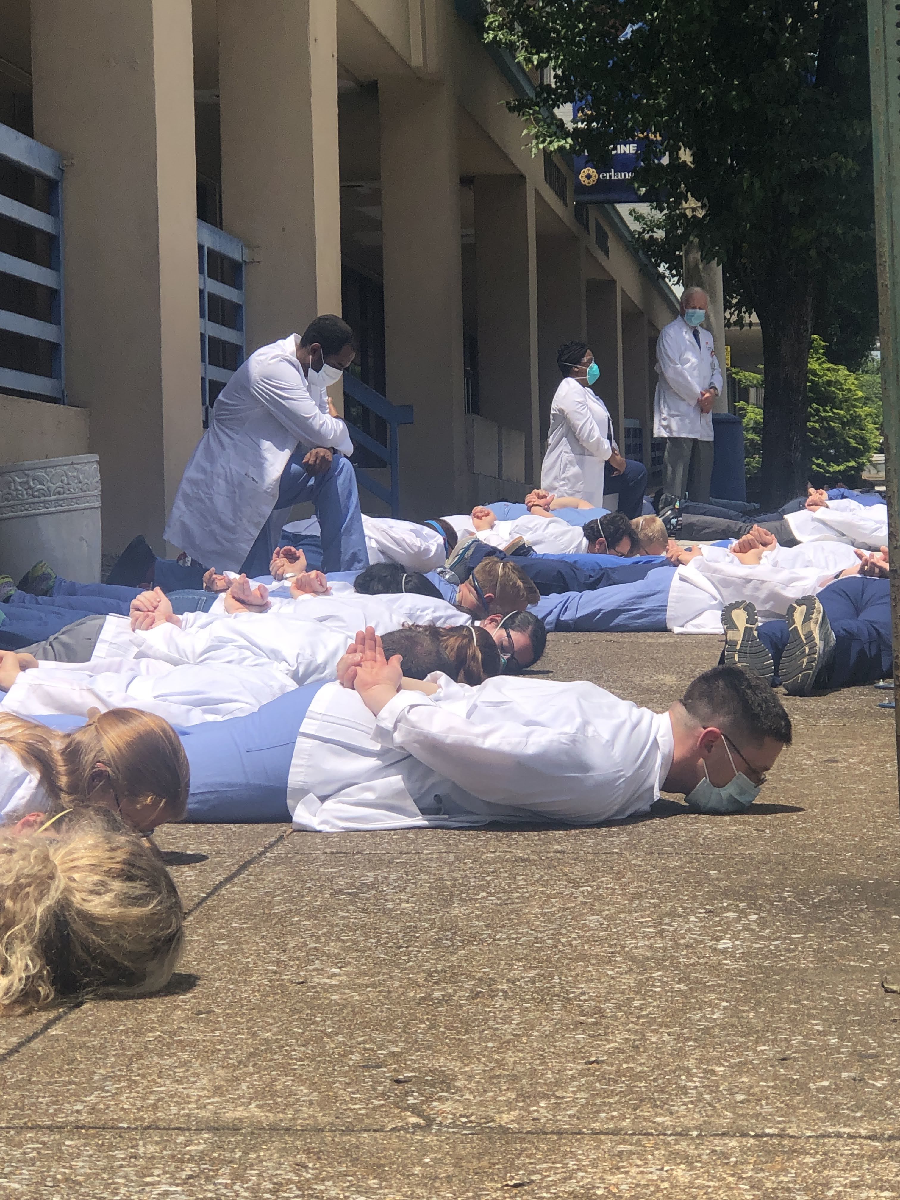 Staff photo by Elizabeth Fite / Medical students and physicians lined the sidewalk in the heart of Chattanooga's medical corridor for nine minutes of silence on Friday, June 5, 2020, in a show of solidarity against racial injustice in the wake of national protests over the death of George Floyd.