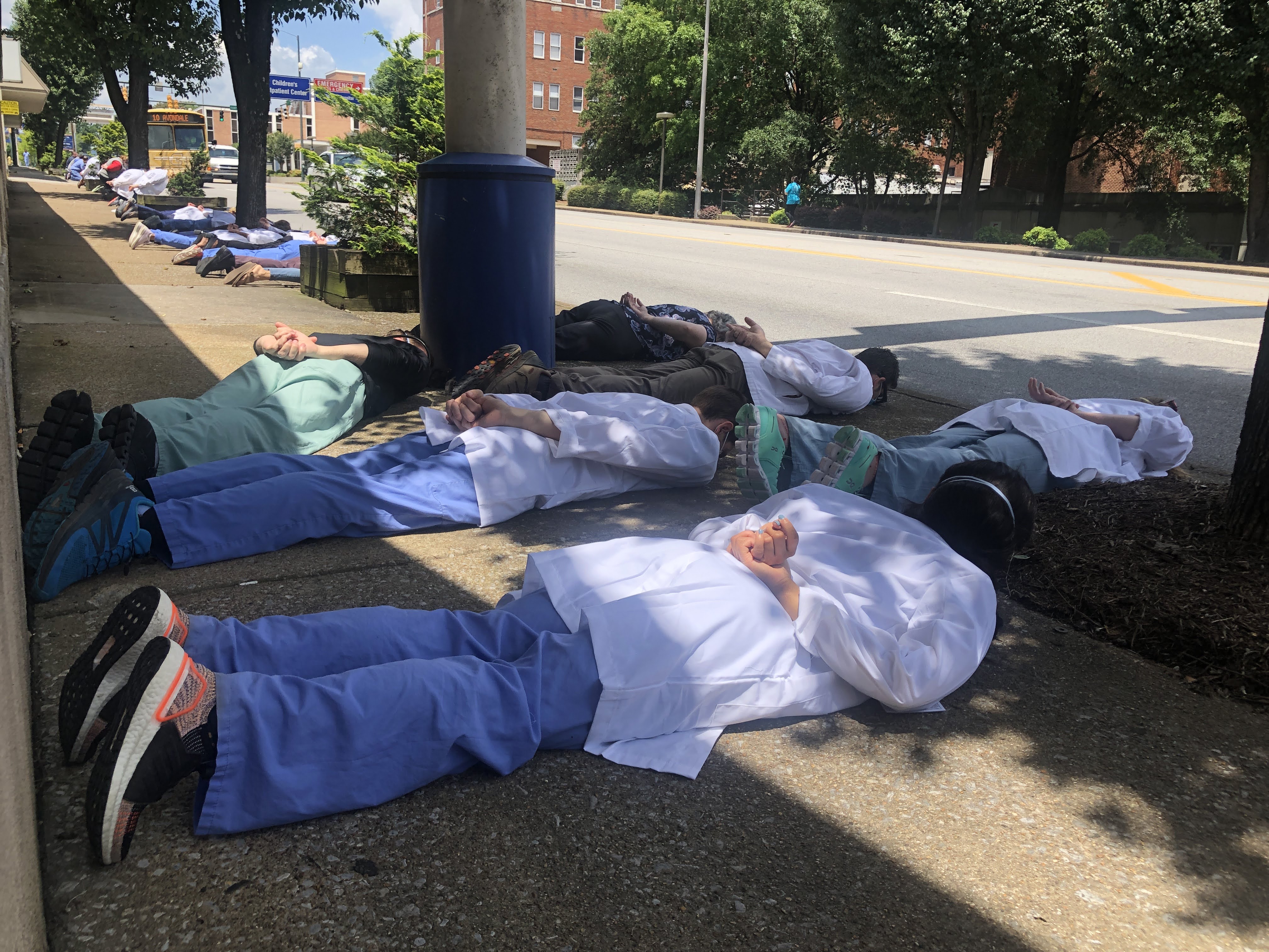 Staff photo by Elizabeth Fite / Medical students and physicians lined the sidewalk in the heart of Chattanooga's medical corridor for nine minutes of silence on Friday, June 5, 2020, in a show of solidarity against racial injustice in the wake of national protests over the death of George Floyd.