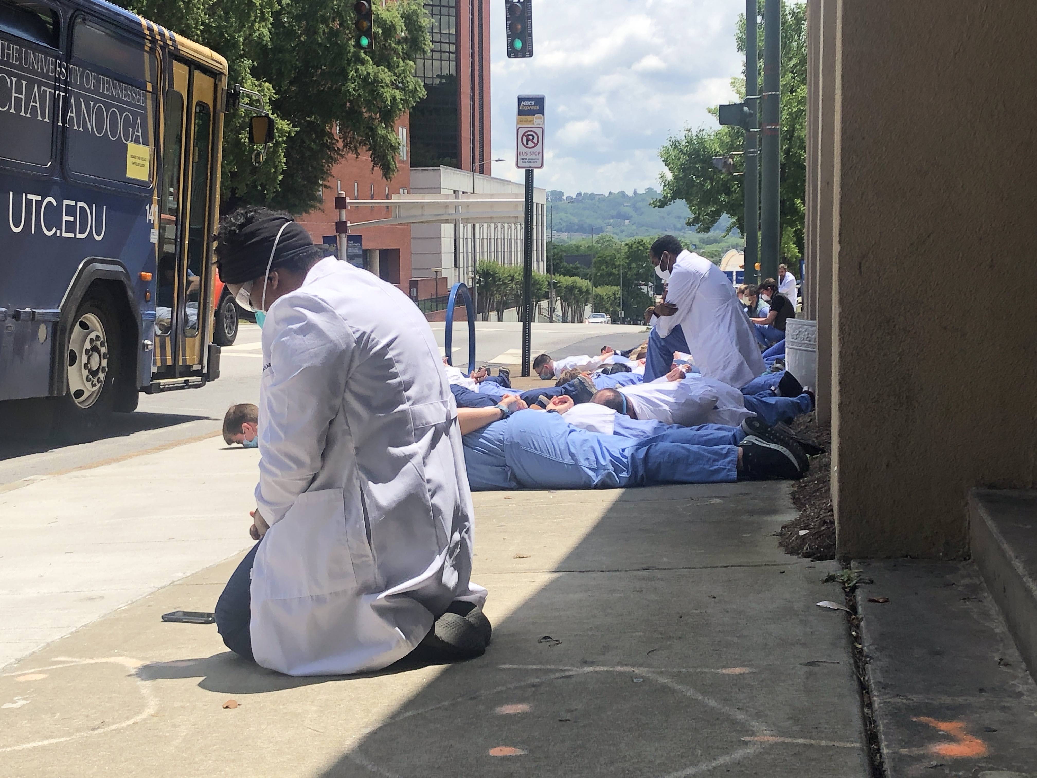 Staff photo by Elizabeth Fite / Medical students and physicians lined the sidewalk in the heart of Chattanooga's medical corridor for nine minutes of silence on Friday, June 5, 2020, in a show of solidarity against racial injustice in the wake of national protests over the death of George Floyd.