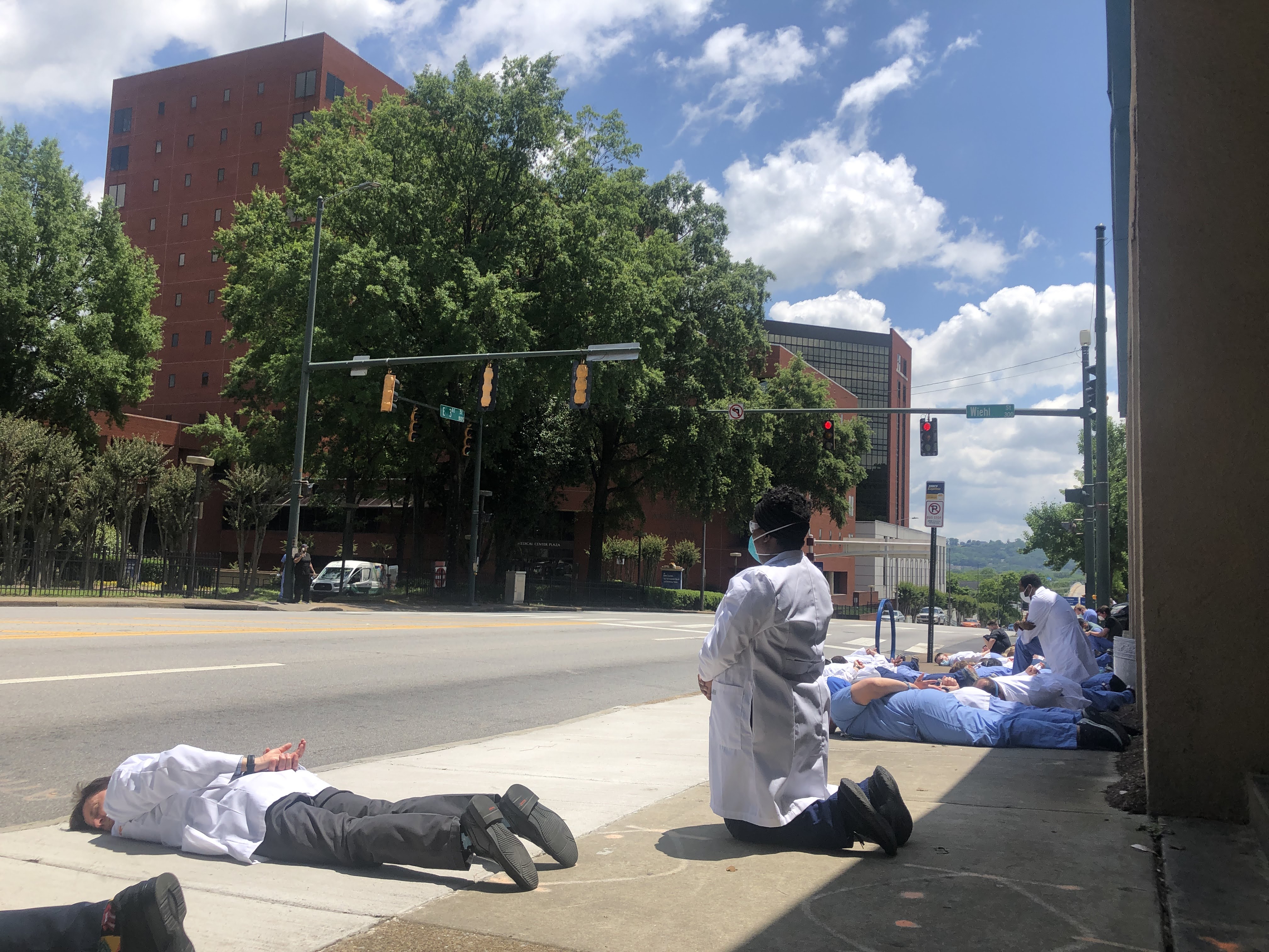 Staff photo by Elizabeth Fite / Medical students and physicians lined the sidewalk in the heart of Chattanooga's medical corridor for nine minutes of silence on Friday, June 5, 2020, in a show of solidarity against racial injustice in the wake of national protests over the death of George Floyd.