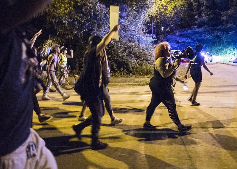 Staff photo by Troy Stolt / Protester Grayson Harvey leads protesters through College Hill Courts during a demonstration on the sixth day of protests in Chattanooga on June 4, 2020. Protesters were marching in response to the May 25 death of George Floyd under the knee of a Minneapolis police officer.