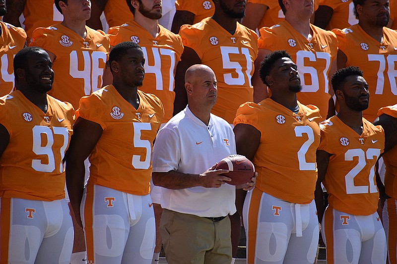 Staff photo / Tennessee football coach Jeremy Pruitt poses for a team photograph on Aug. 5, 2018, at Neyland Stadium in Knoxville.