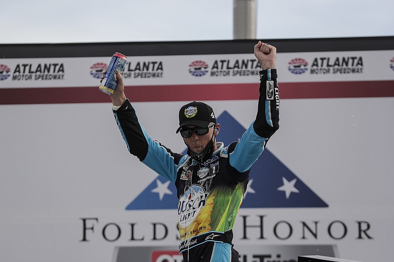 AP photo by Brynn Anderson / NASCAR driver Kevin Harvick celebrates after winning Sunday's Cup Series race at Atlanta Motor Speedway in Hampton, Ga.