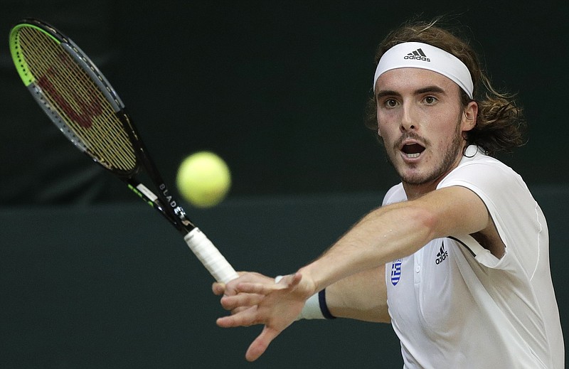 AP photo by Aaron Favila / Stefanos Tsitsipas prepares to return the ball to Alberto Lim during a Davis Cup match on March 6 in Manila.