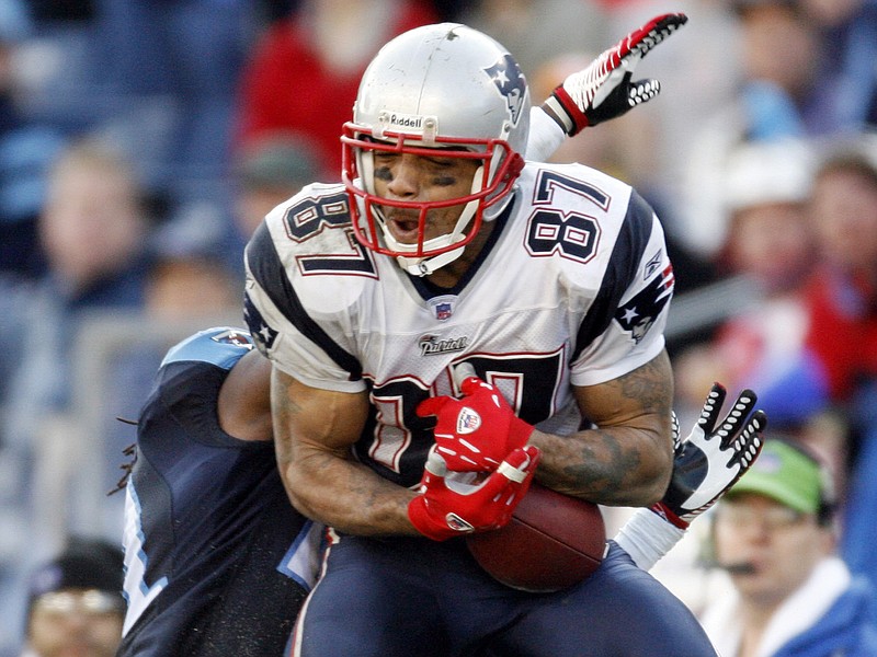 AP photo by John Russell / New England Patriots wide receiver Reche Caldwell (87) catches a pass for a 62-yard touchdown ahead of Tennessee Titans cornerback Reynaldo Hill on Dec. 31, 2006, in Nashville.