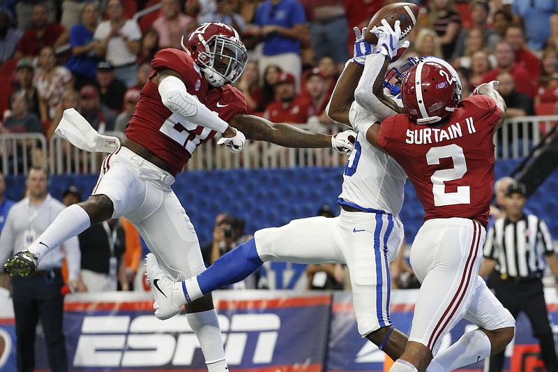 AP photo by John Bazemore / Alabama defensive backs Jared Mayden, left, and Patrick Surtain II break up a pass intended for Duke wide receiver Jalon Calhoun on Aug. 31, 2019, in Atlanta.