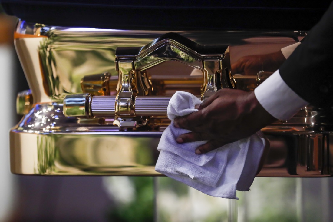 The casket is polished before the funeral for George Floyd on Tuesday, June 9, 2020, at The Fountain of Praise church in Houston. Floyd died after being restrained by Minneapolis Police officers on May 25. (Godofredo A. Vásquez/Houston Chronicle via AP, Pool)