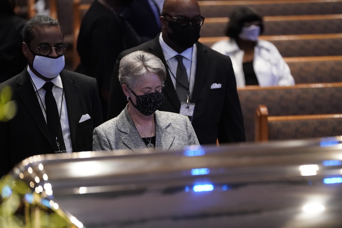 Former Houston Mayor Annise Parker pauses by the casket of George Floyd during a funeral service for Floyd at The Fountain of Praise church, Tuesday, June 9, 2020, in Houston. (AP Photo/David J. Phillip, Pool)