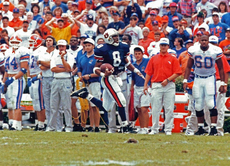 Auburn University photo / Auburn cornerback Calvin Jackson returns an interception of Florida quarterback Danny Wuerffel 96 yards for a touchdown to help Terry Bowden's Tigers to a 38-35 upset of Steve Spurrier's Gators in 1993.