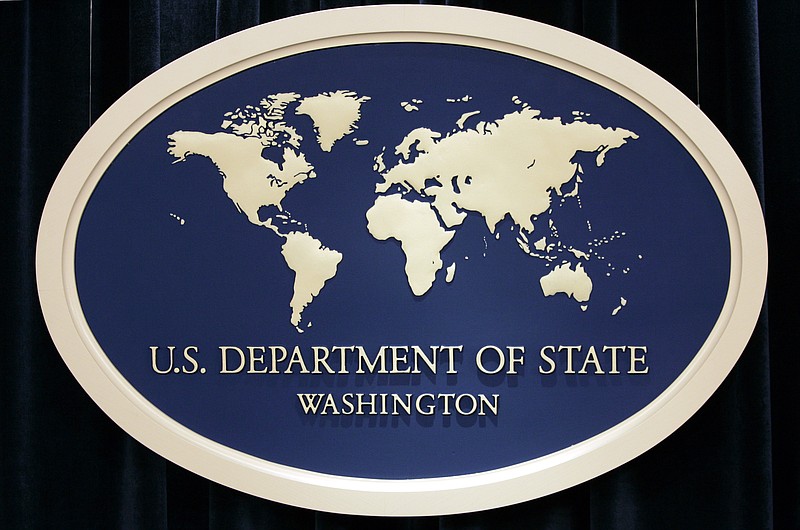 FILE - This Aug. 10, 2006, file photo shows the sign used as the backdrop for press briefings at the U.S. Department of State in Washington. (AP Photo/Charles Dharapak. File)


