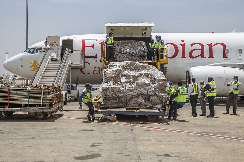 In this photo released by Xinhua News Agency, workers unload donations from Jack Ma Foundation and Alibaba Foundation at the Blaise Diagne International Airport in Dakar, Senegal, on Saturday, March 28, 2020. As the coronavirus spread, the world's richest communist dug into his deep pockets. Jack Ma, founder of e-commerce giant Alibaba Group and a member of the ruling Communist Party, helped to pay for 1,000 ventilators delivered to New York in April. Ma's foundation also is giving ventilators, masks and other supplies in Africa, Latin America and Asia.(Eddy Peters/Xinhua via AP)


