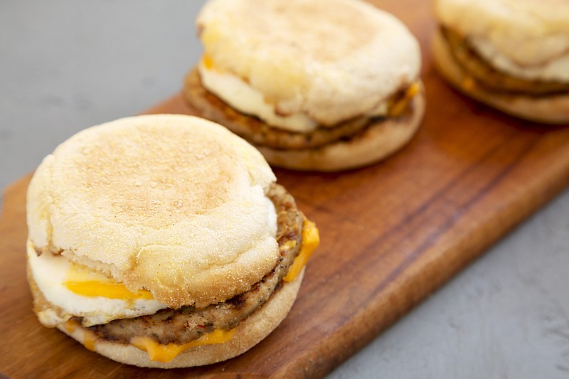 Homemade pork roll egg sandwich on a rustic wooden board on a gray surface, side view. Close-up. - stock photo sandwich tile breakfast tile food / Getty Images
