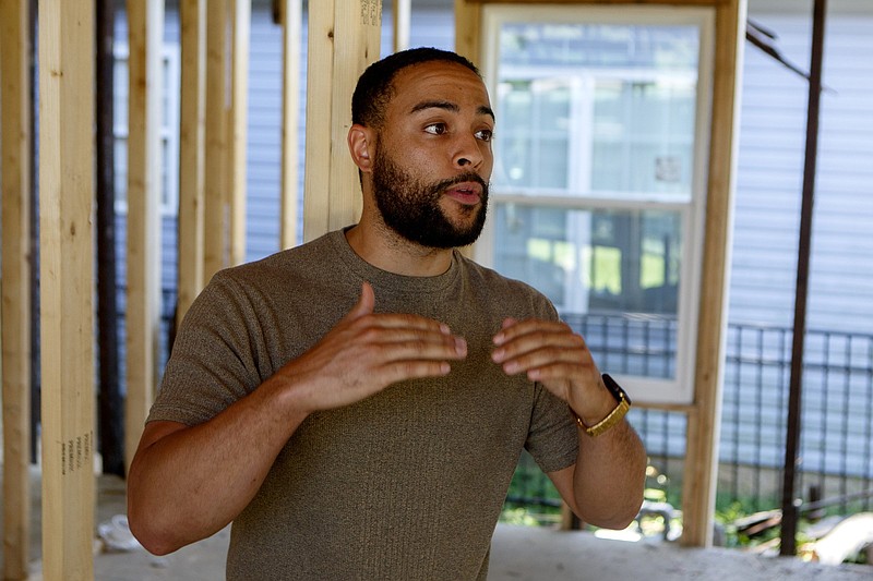 Staff photo by C.B. Schmelter / Joshua Lloyd talks to the Times Free Press at a Bushtown home renovation on Monday, June 1, 2020 in Chattanooga, Tenn.