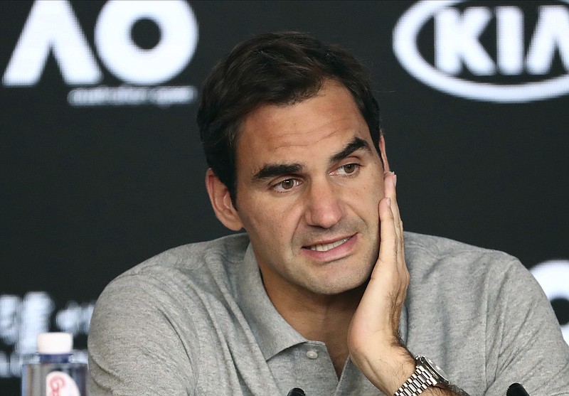AP photo by Dita Alangkara / Roger Federer speaks during a news conference after his Australian Open semifinals loss to Novak Djokovic on Jan. 30 in Melbourne.