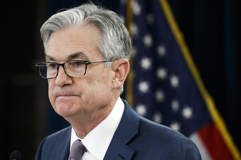 FILE - In this Tuesday, March 3, 2020 file photo, Federal Reserve Chair Jerome Powell pauses during a news conference to discuss an announcement from the Federal Open Market Committee, in Washington. The Federal Reserve says it will keep buying bonds, Wednesday, June 10, to maintain low borrowing rates and support the U.S. economy in the midst of a recession. And it says nearly all the Fed's policymakers foresee no rate hike through 2022. .(AP Photo/Jacquelyn Martin, File)
