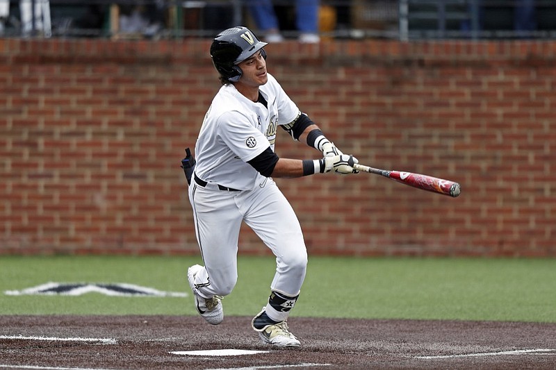 FILE - In this May 11, 2019, file photo, Vanderbilt's Austin Martin connects for a hit during an NCAA college baseball game against Missouri in Nashville, Tenn. The Detroit Tigers are rebuilding around an impressive group of minor league pitchers. Now, it might be time to add a star hitting prospect to the mix. Whether it's Arizona State slugger Spencer Torkelson or Vanderbilt's Austin Martin, Detroit has a chance to add another potential standout when it makes the No. 1 selection in Wednesday night's Major League Baseball draft. (AP Photo/Wade Payne, FIle)